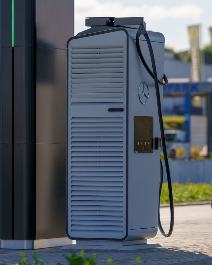 A sleek electric vehicle charging station outdoors, showcasing modern clean transport.